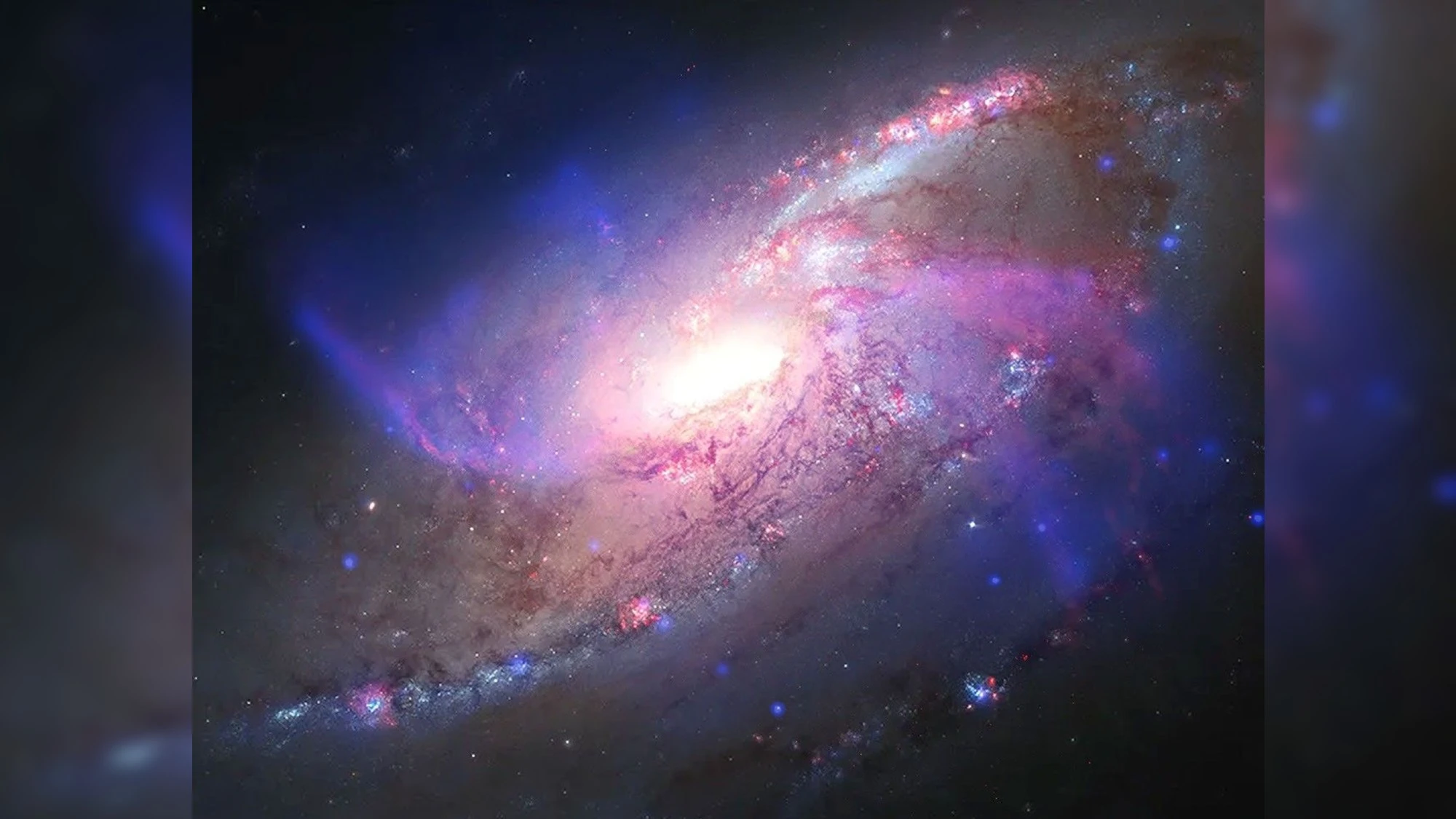 کهکشان مِسیه ۱۰۶ (NGC 4258): دو بازوی نامعمول و ردپای سیاهچالهٔ مرکزی