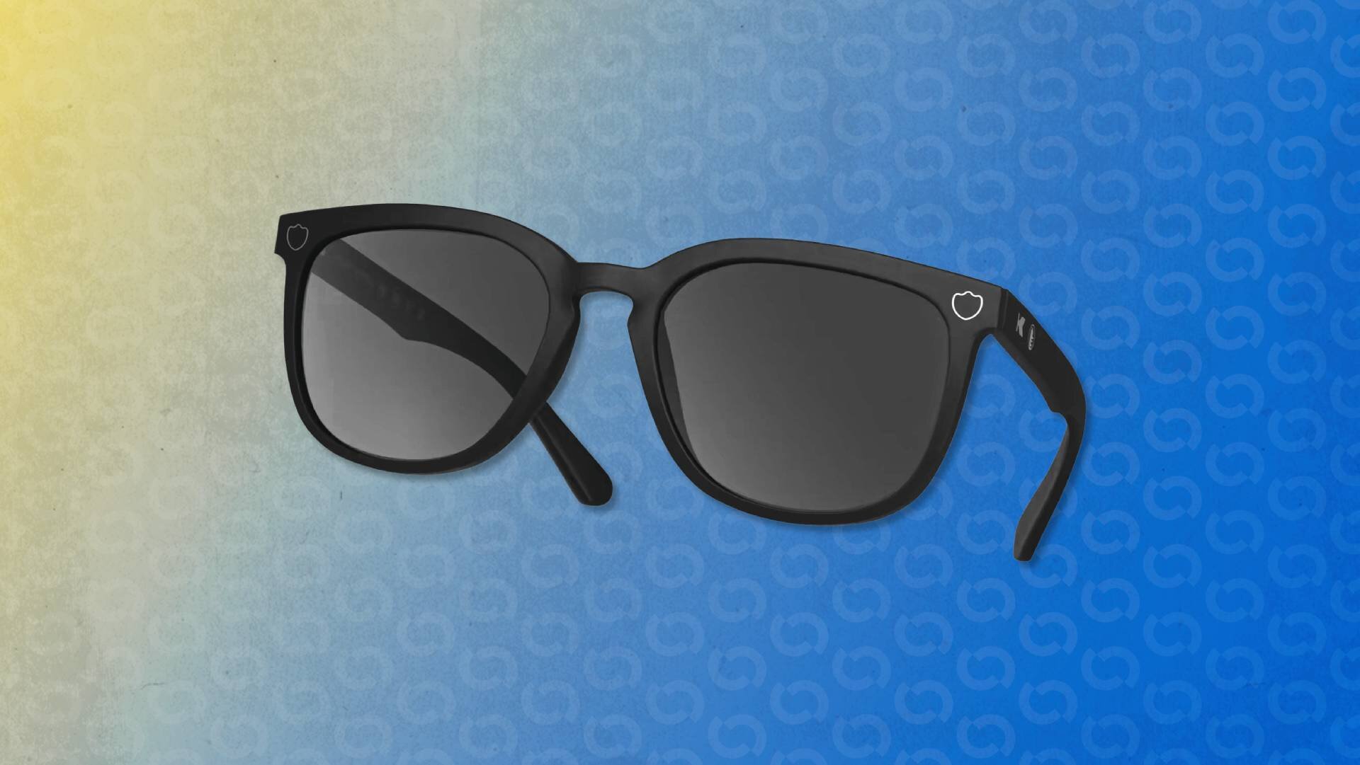 عینک Normal F***ing Sunglasses روی میز با قاب سیاه مات